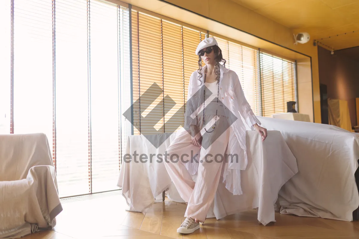 Picture of Happy couple in wedding attire holding bouquet closely.