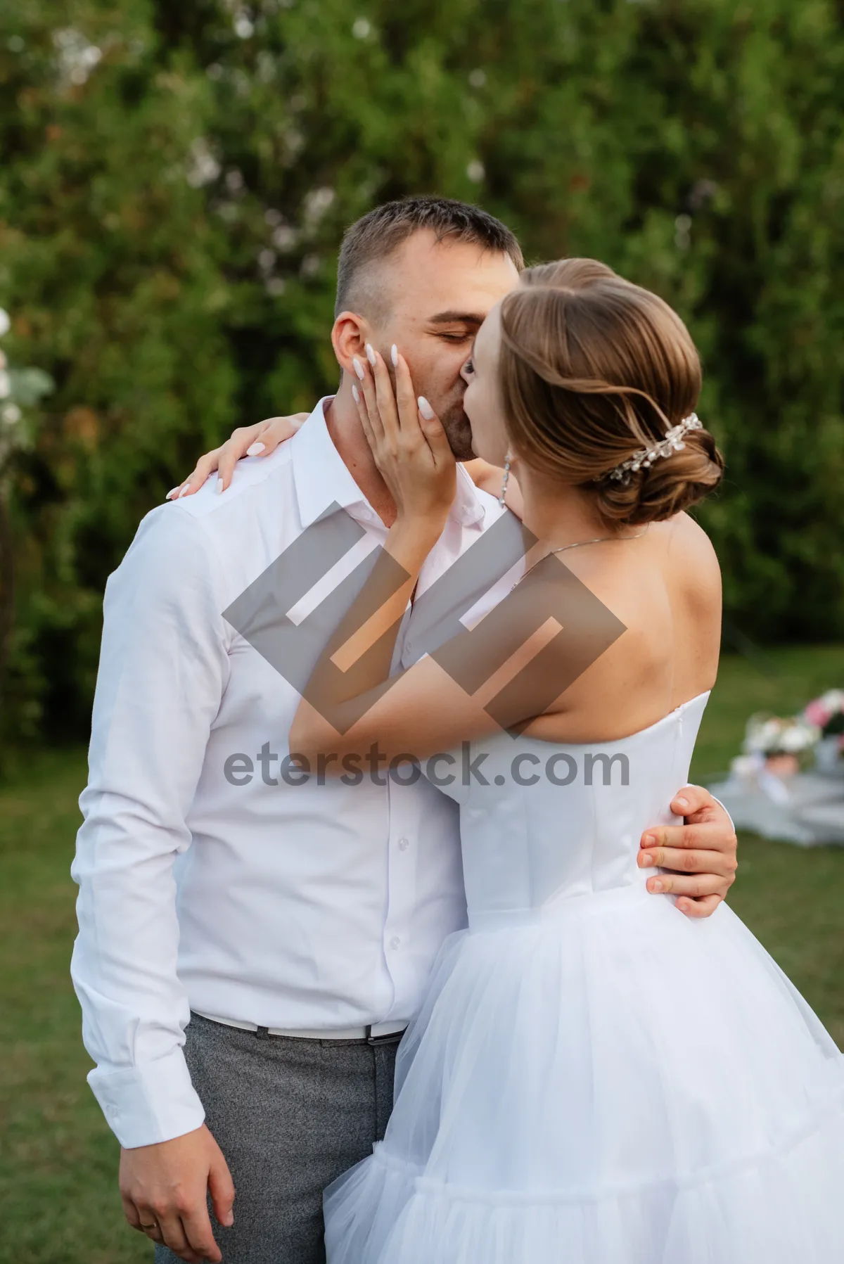 Picture of Happy smiling couple in a summer park joyfully.