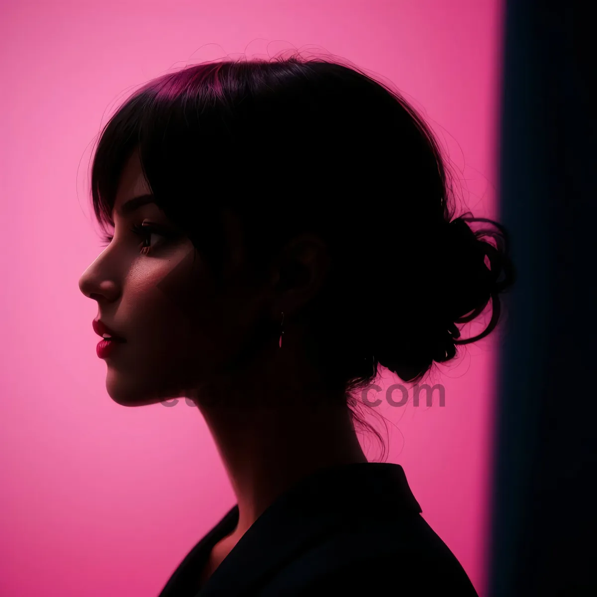 Picture of Attractive brunette model with sensual, dark makeup aesthetic.