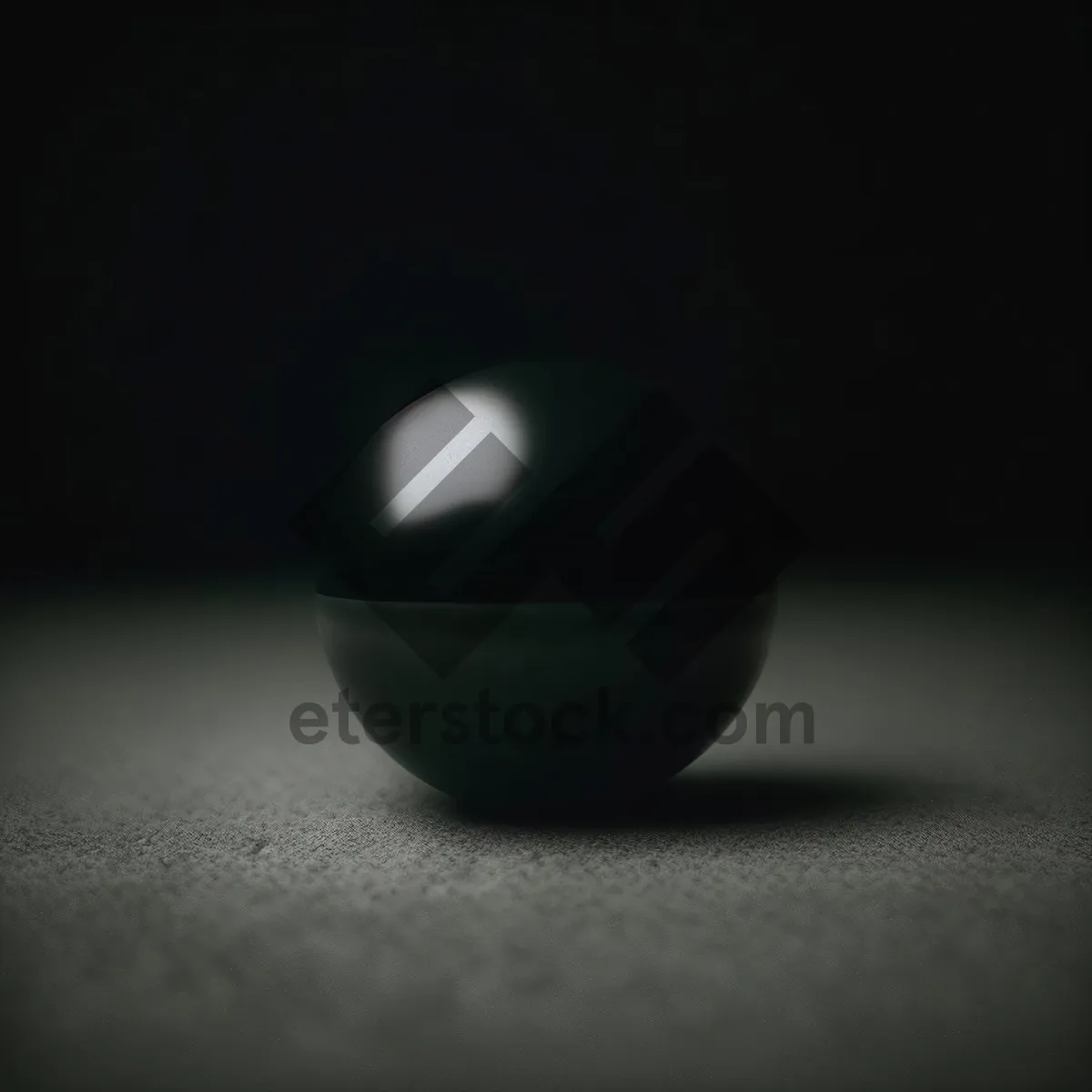 Picture of Black Egg on Pool Table with Game Equipment