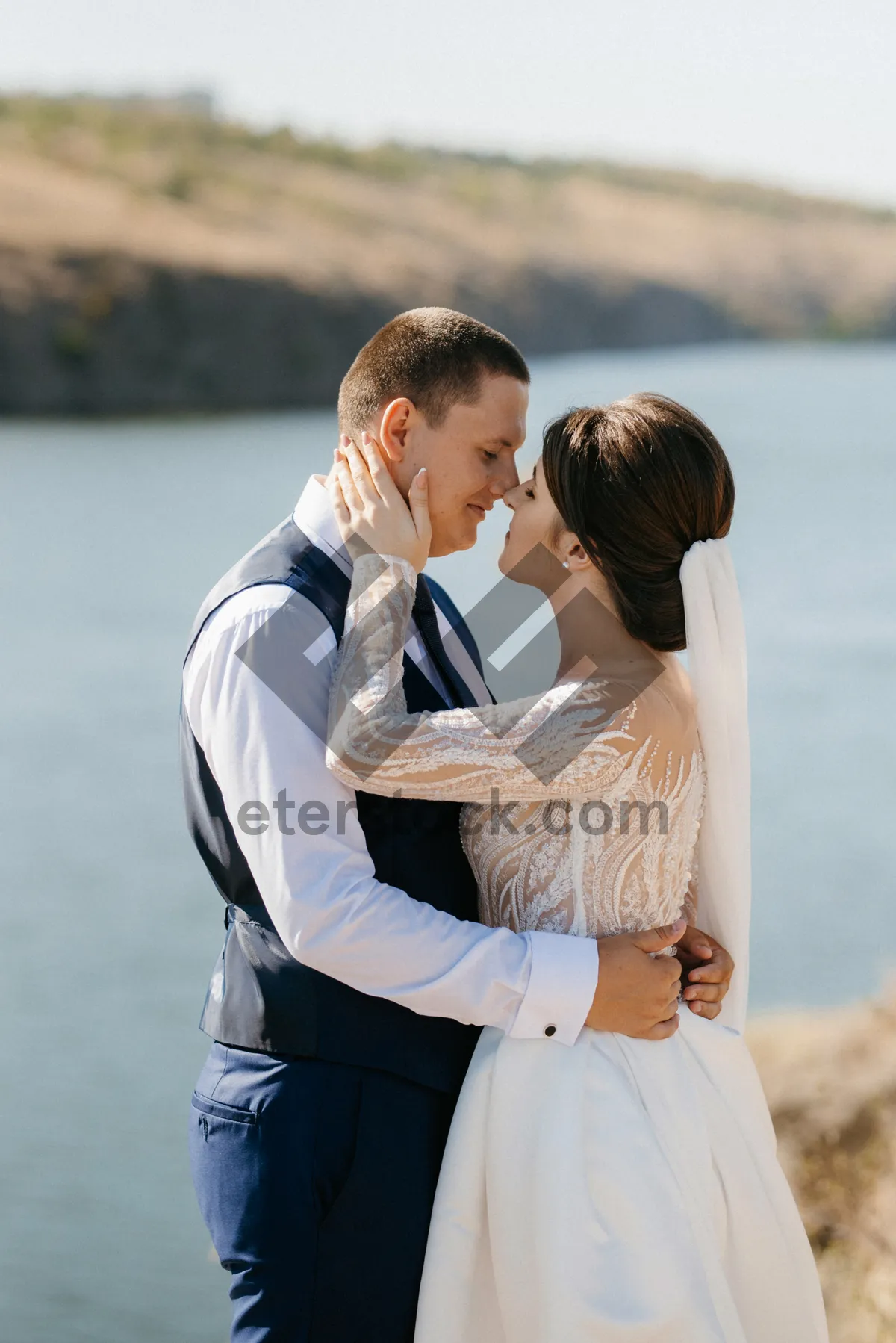 Picture of Happy Couple Smiling on Beach Together in Summer