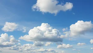 Bright sunny summer landscape with fluffy clouds and clear skies.