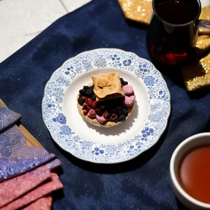 Gourmet breakfast plate with hot coffee and sweet pastry