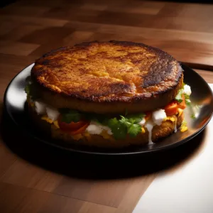 Delicious gourmet cheeseburger with healthy salad and vegetables.