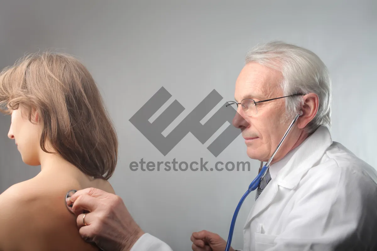 Picture of Elderly male doctor with stethoscope in clinic.