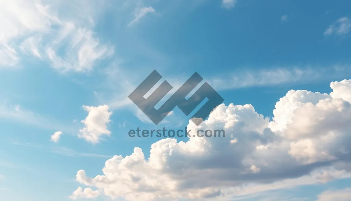 Picture of Bright Summer Sky with Fluffy Clouds and Sunshine