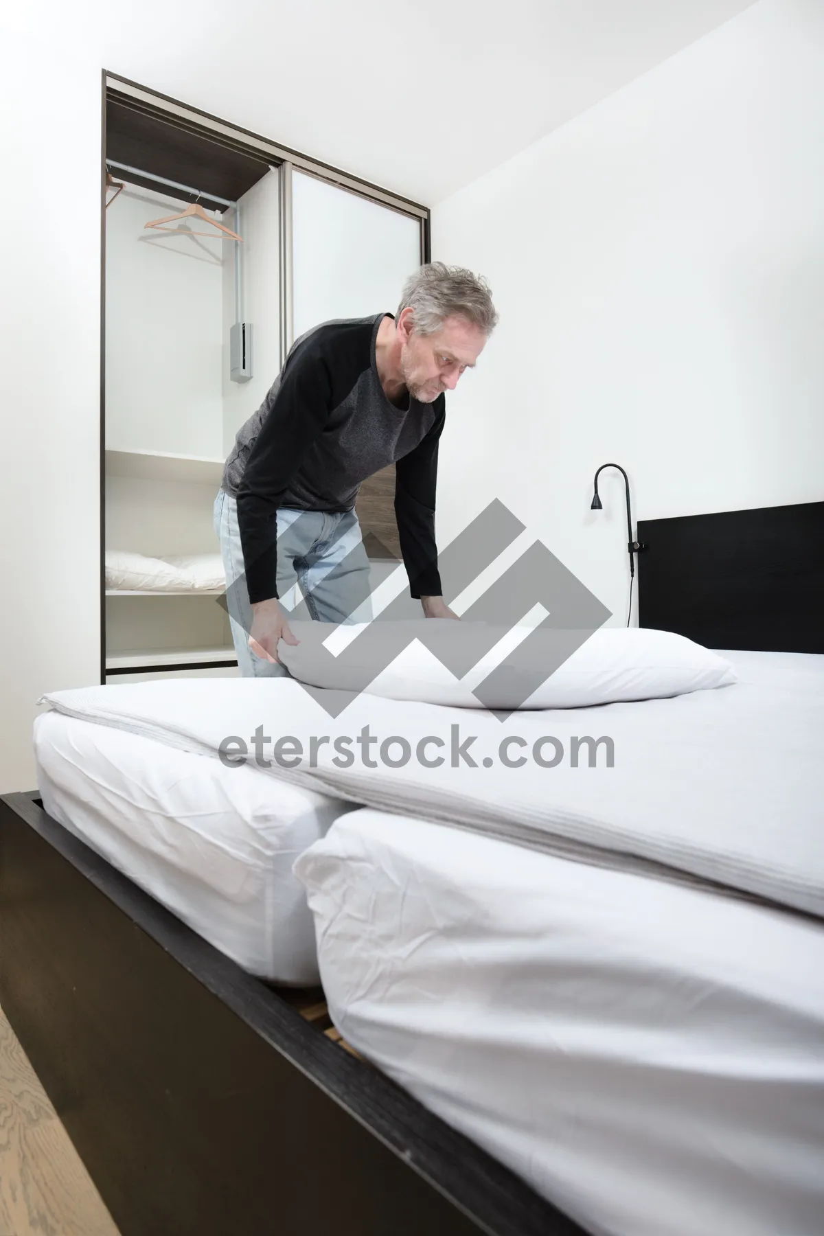 Picture of Interior cozy bedroom with smiling person on luxury sofa.