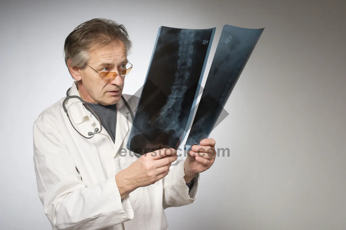 Picture of Professional male doctor in white coat with stethoscope