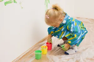 Happy child playing with toy cleaner.