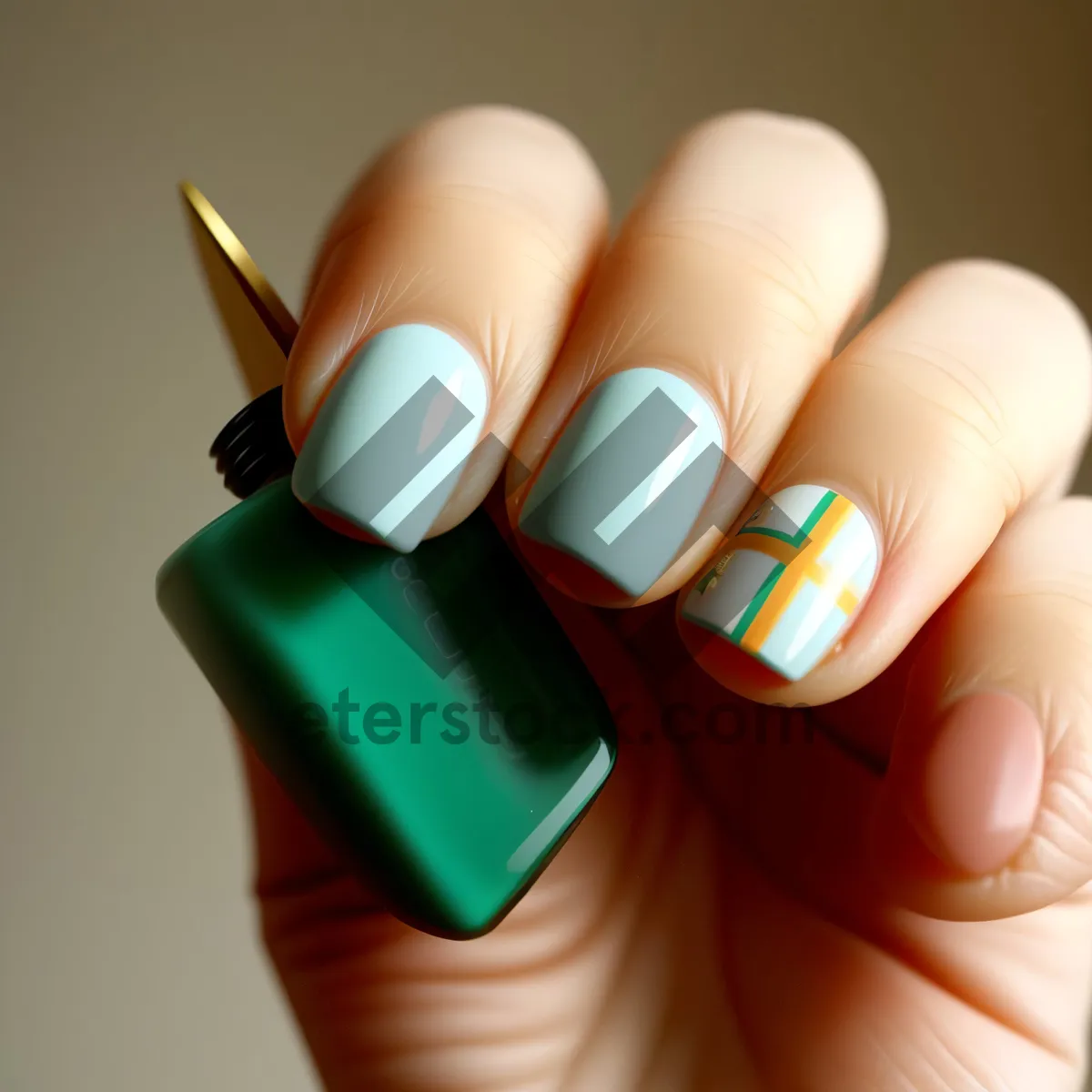 Picture of Close-up of a manicured hand with rubber eraser for nail treatment