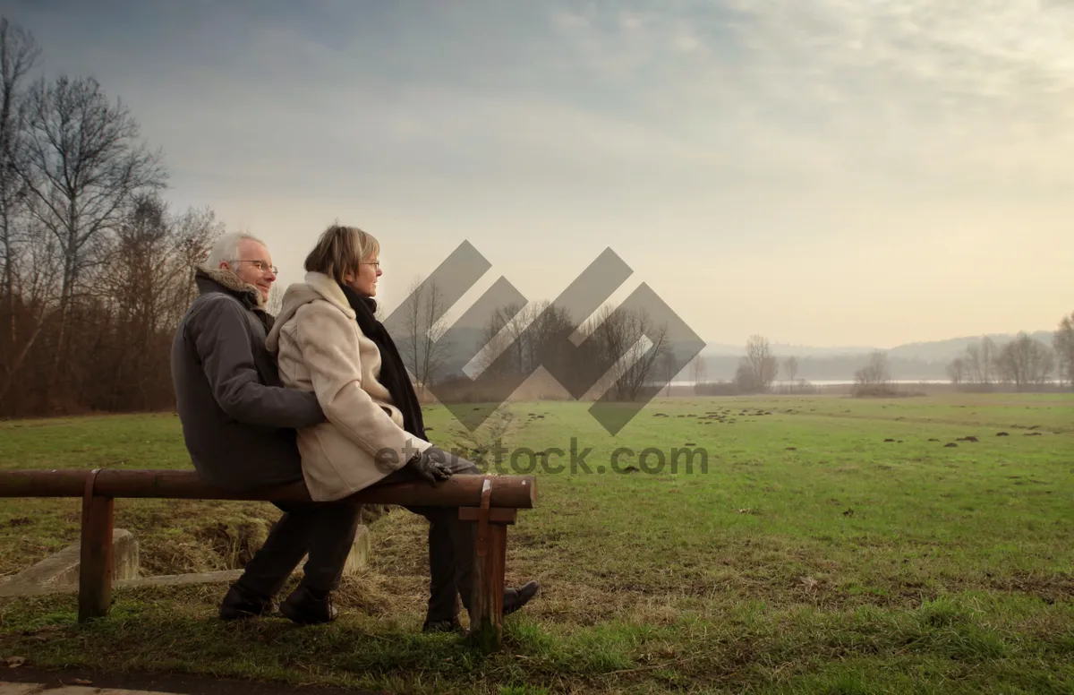 Picture of Happy man sitting in park under summer sky.