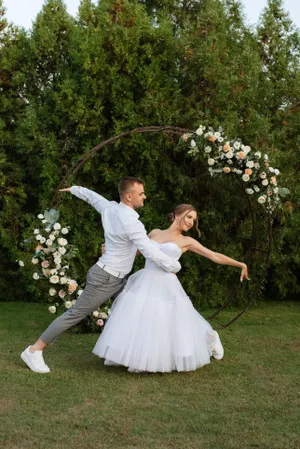 Happy bride and groom with bouquet on wedding day