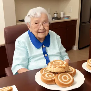 Happy Grandma Enjoying Homely Breakfast With Loved Ones