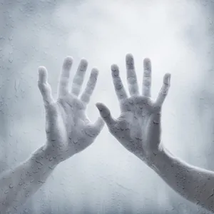 Pair of Hands On Wet Steamy Glass