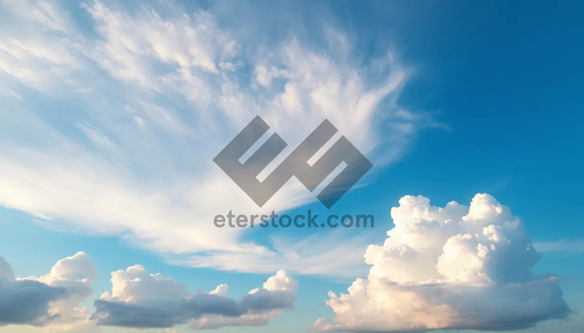 Picture of Vibrant Summer Sky with Fluffy Clouds