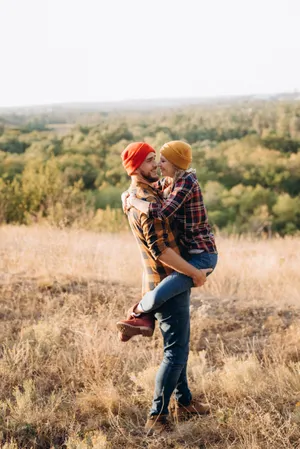 Happy man hiking in scenic countryside landscape.