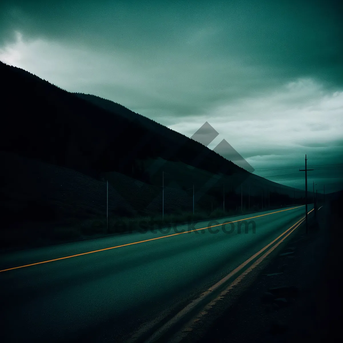 Picture of Journey on Asphalt: A Scenic Drive Through Cloudy Mountains