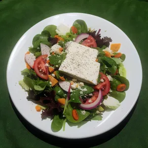 Delicious Gourmet Salad with Fresh Vegetables and Cheese