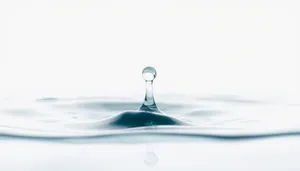 Refreshing water with ice cubes in glass