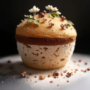 Chocolate cupcake with creamy frosting and coffee cup.