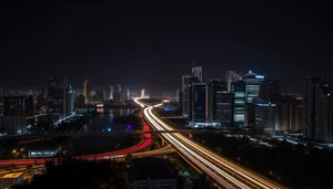 Modern city skyline at night with light trails