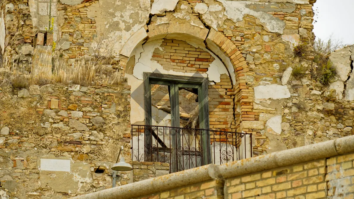 Picture of Medieval church with stone arch and ancient facade.