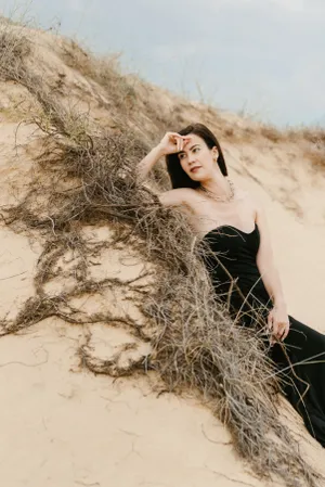 Pretty model posing in wheat field with cereal.