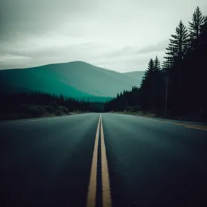 Scenic Mountain Highway Under Cloudy Skies