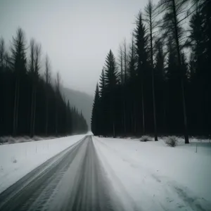 Winter Wonder Road: Majestic Mountainous Scenery with Snow-Covered Bridge