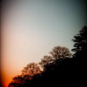 Spectacular Sunset Silhouette Over Scenic Landscape