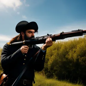 Man aiming assault rifle at clay pigeon