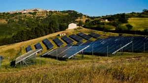 Rural solar panel array under clear blue sky