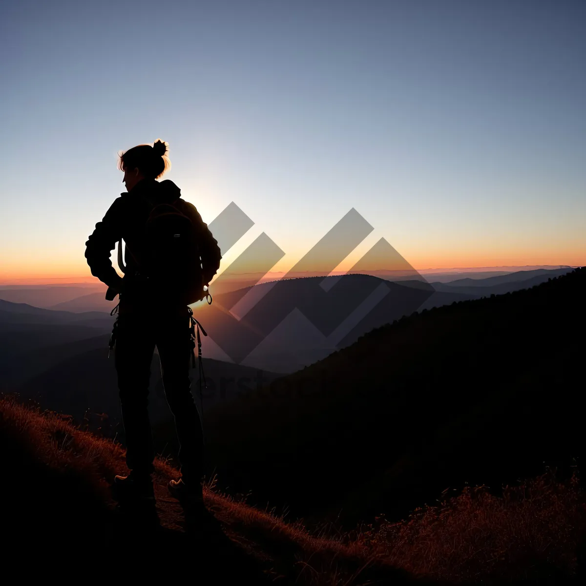 Picture of Sunset Mountain Hiker: Adventurous Silhouette in Majestic Landscape