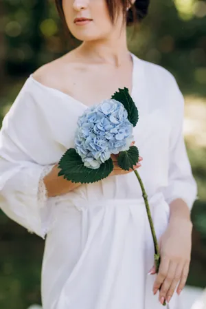 Happy bride and groom celebrate marriage outdoors with flowers