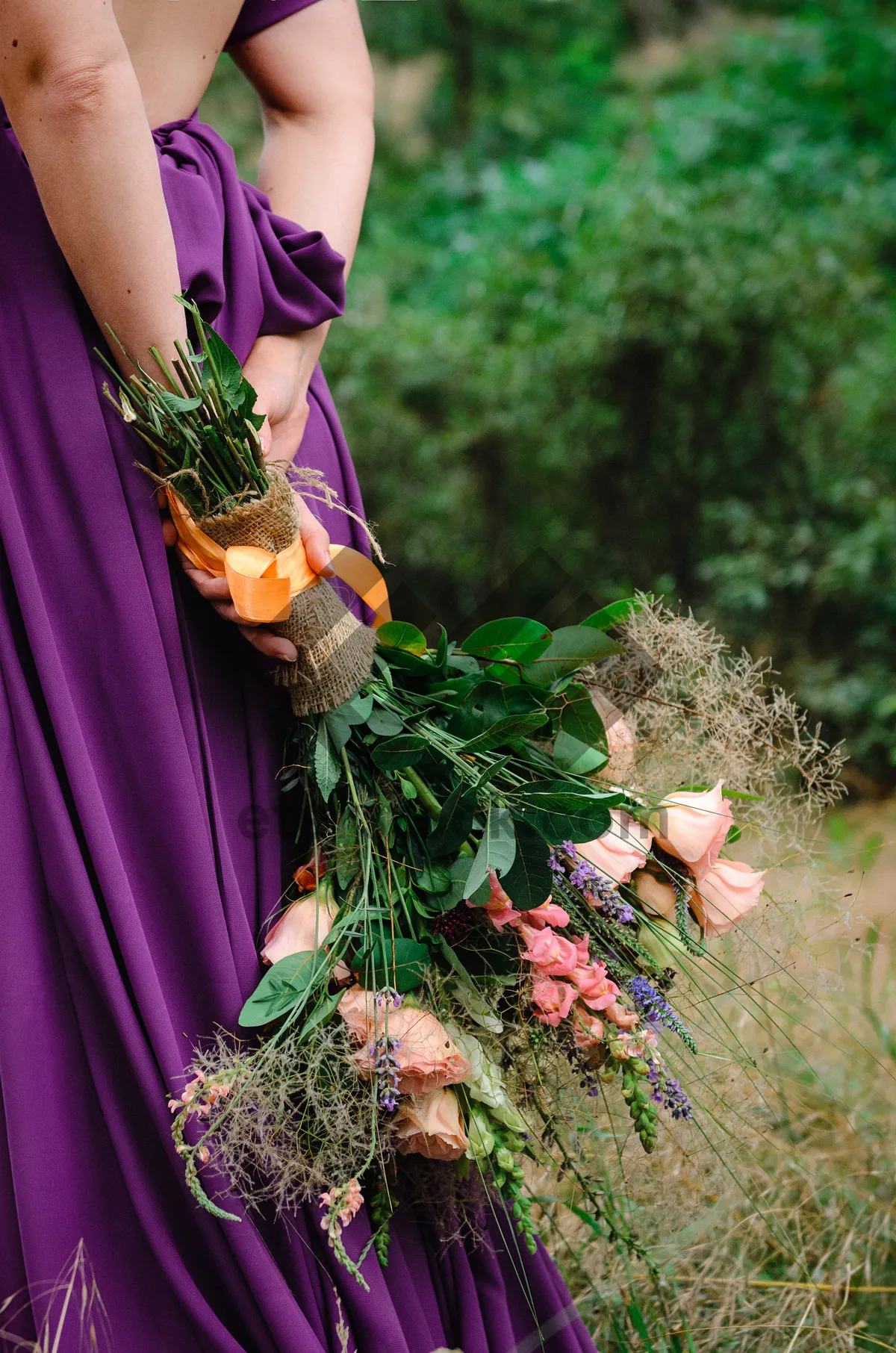 Picture of Beautiful woman in summer dress with flower bouquet