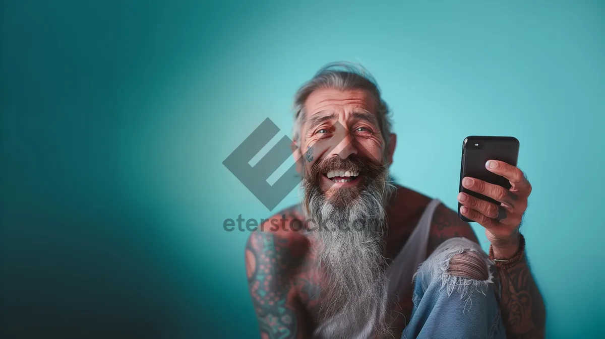 Picture of Elderly man with mustache and beard smiling portrait.