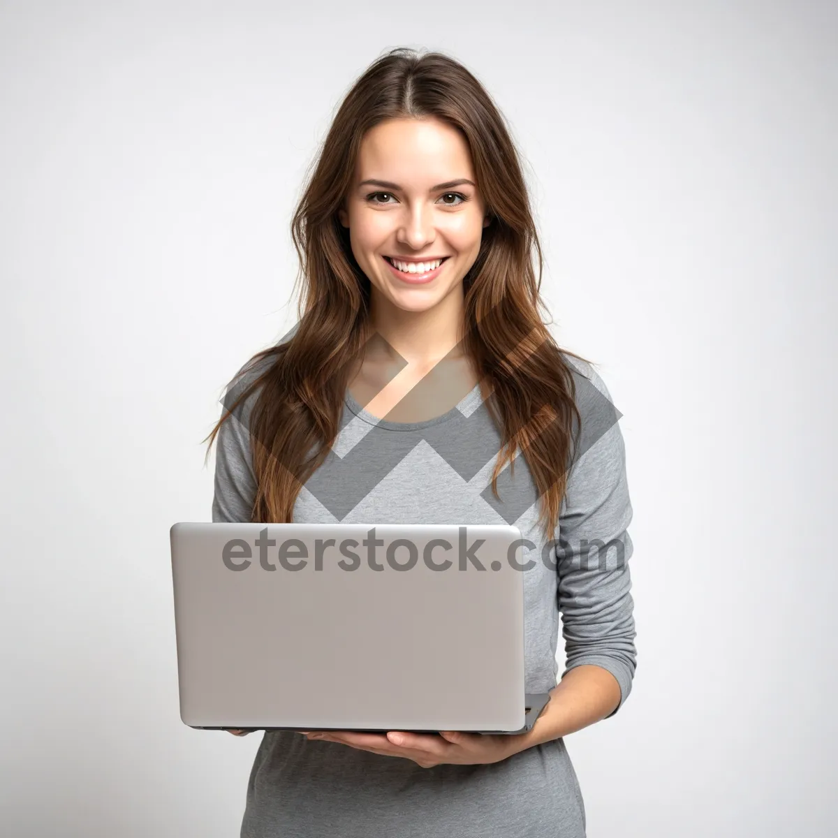 Picture of Attractive brunette businesswoman working on laptop in office.