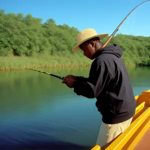 Male golfer fishing with equipment and reel