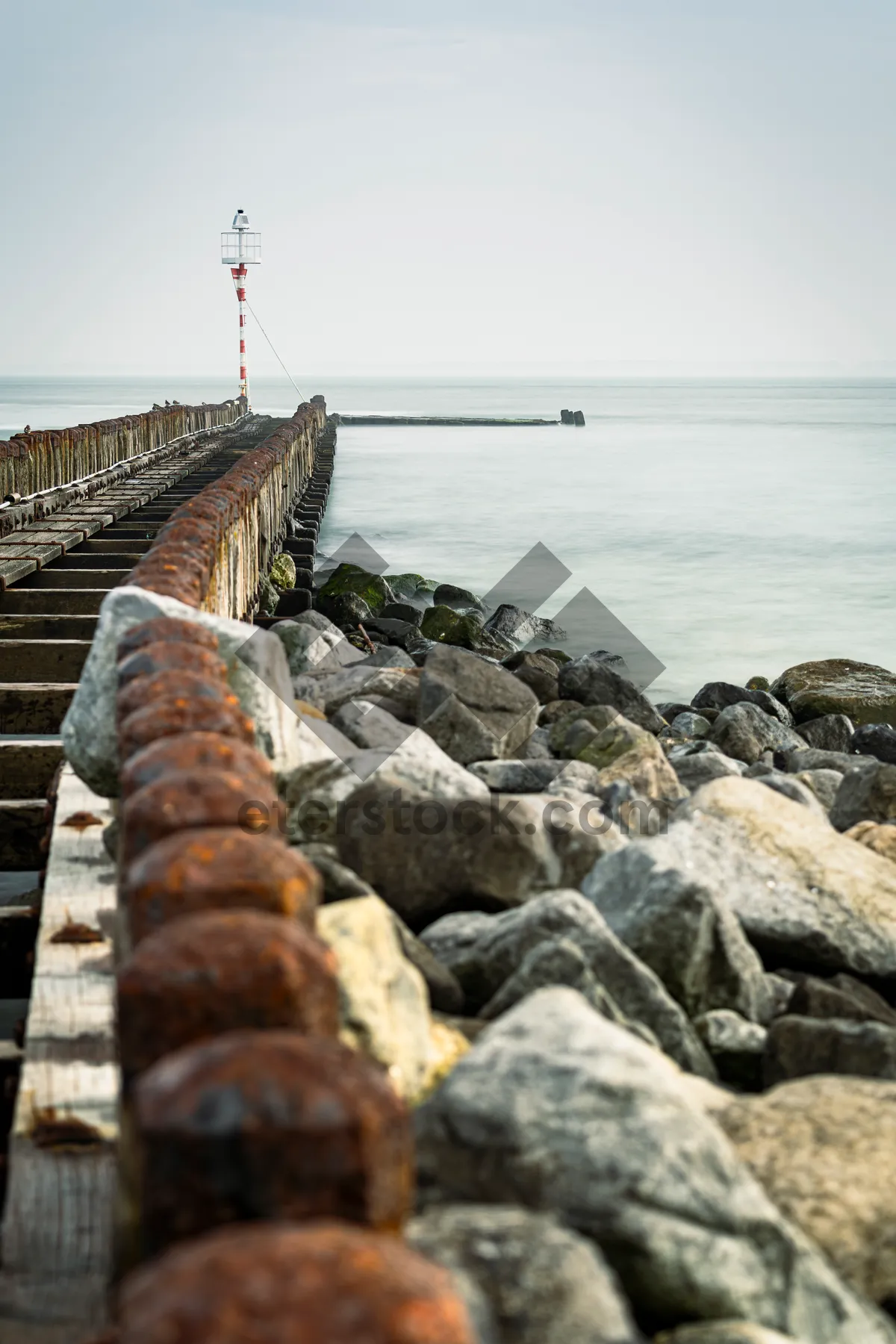 Picture of Ocean Waves Crash Against Barrier Rocks - Seascape