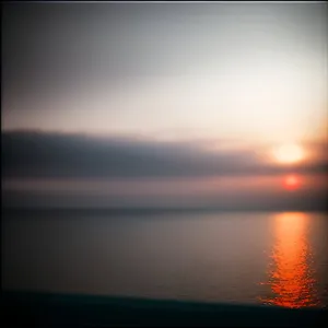 Vibrant Sunset Reflection on Ocean Horizon