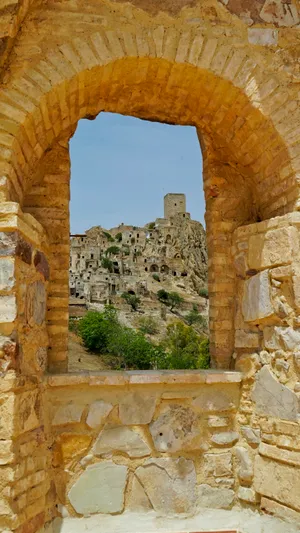 Roman Triumphal Arch Against Historical Sky