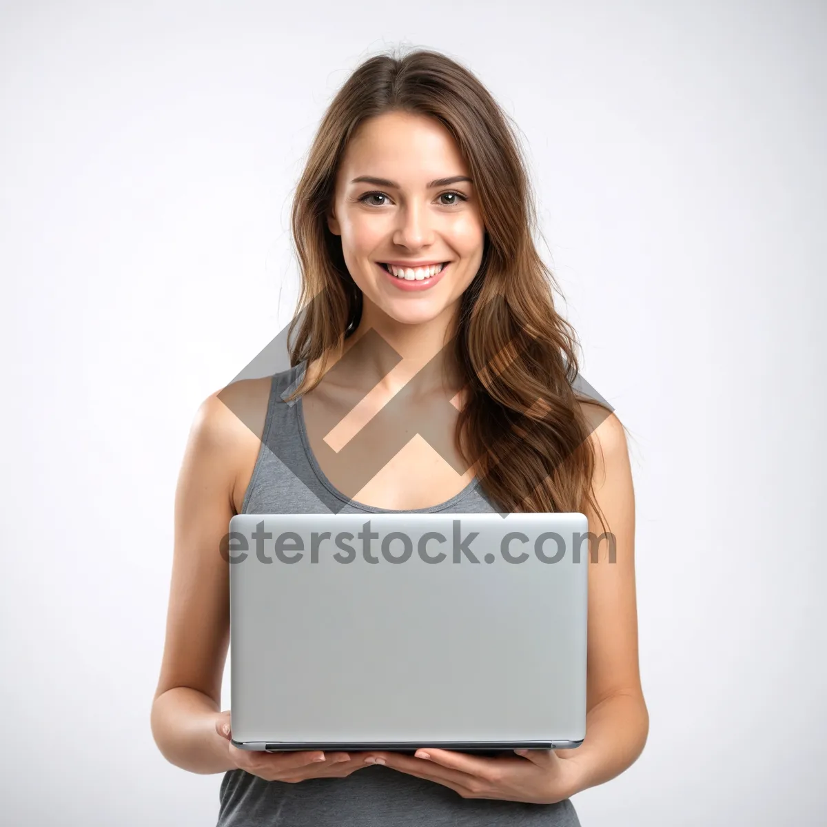 Picture of Attractive brunette businesswoman smiling while working on laptop.