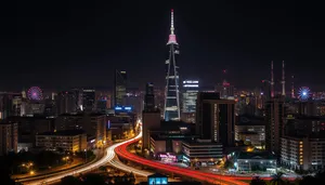 Modern office tower at dusk in bustling business district.