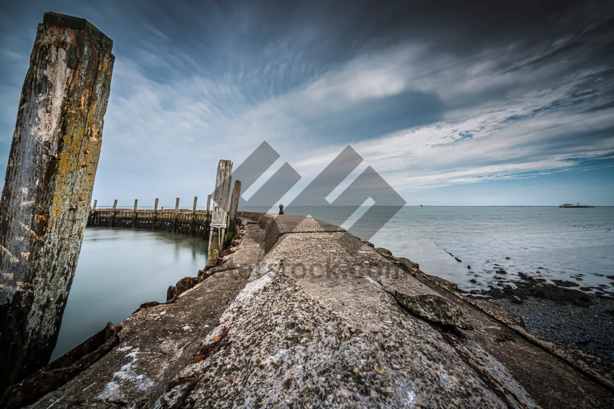 Picture of Tower on Beach with Rocks and Waves