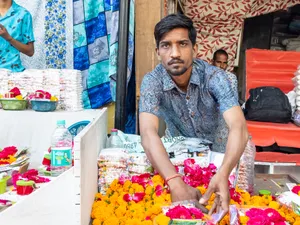 Happy food seller smiling at child