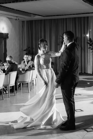 Happy bride and groom with wind instrument