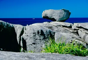 Coastal cliffs overlooking the ocean on a sunny day. The colors and crystal clear water of the archipelago of the Similan Islands National Park, Thailand, Asia