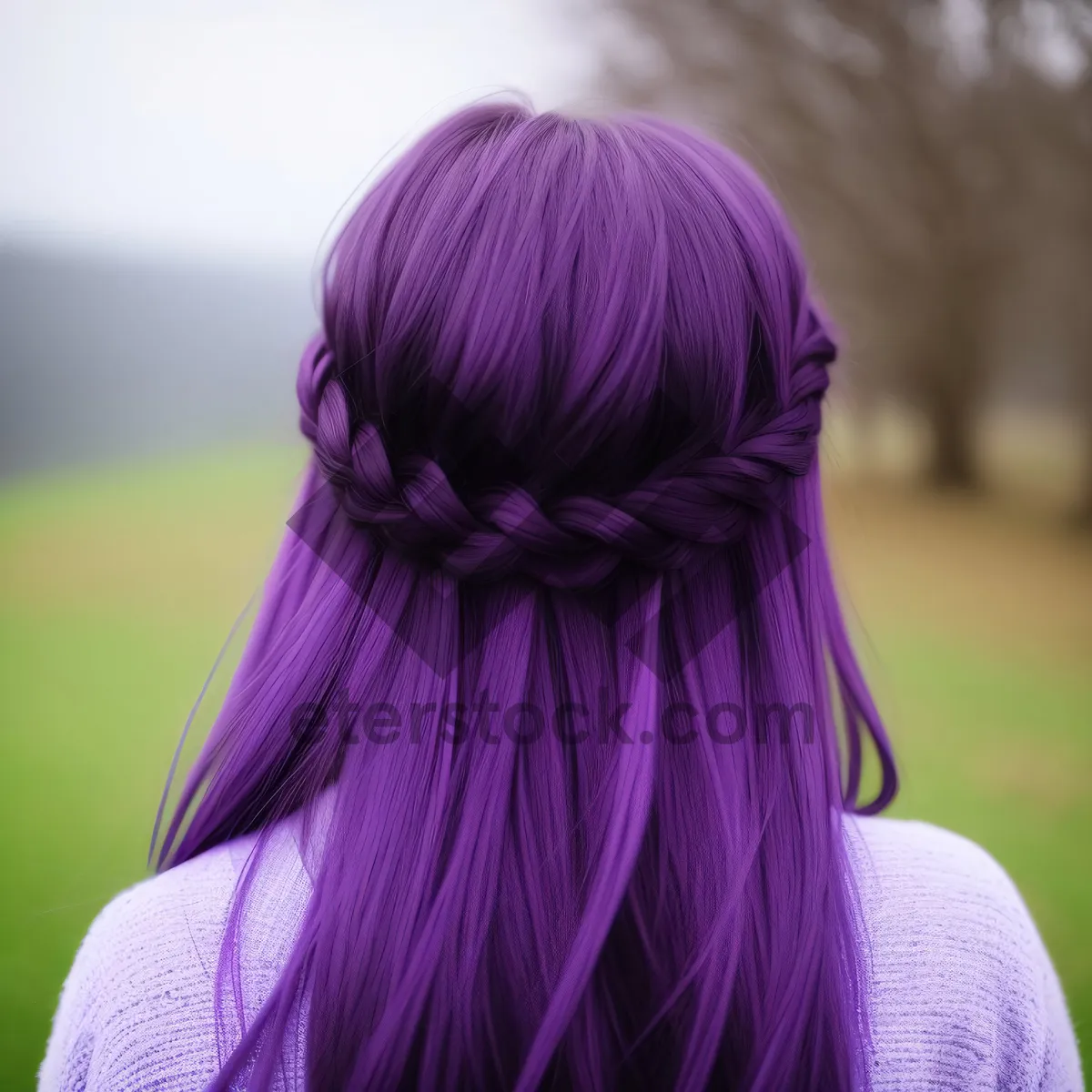 Picture of Happy blond woman with cute braided hairstyle