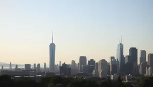 Modern office tower overlooking city skyline at sunset.