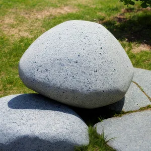 Golf Equipment on Green Grass - a Pebble-Studded Rugby Ball